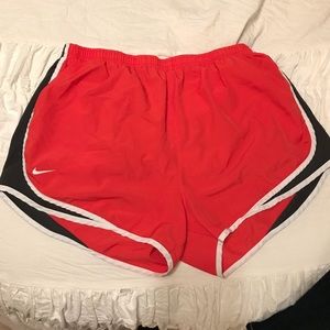 Red, black, and white Nike Tempo Running Shorts